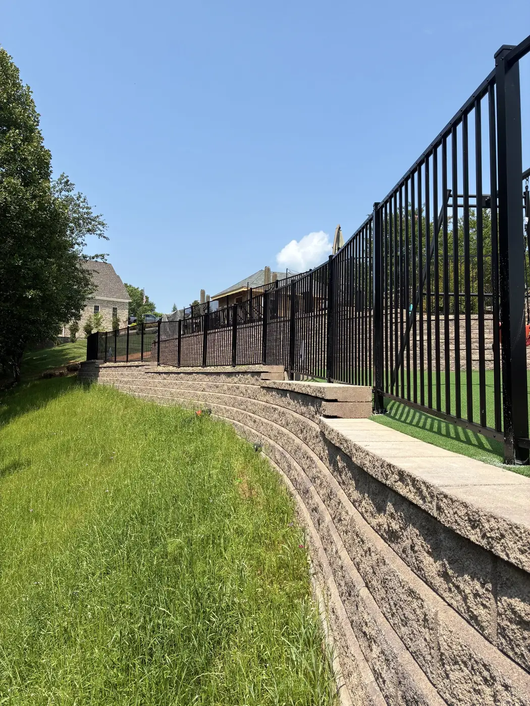 Black aluminum fence on a commercial property installed by Star City Fence Co