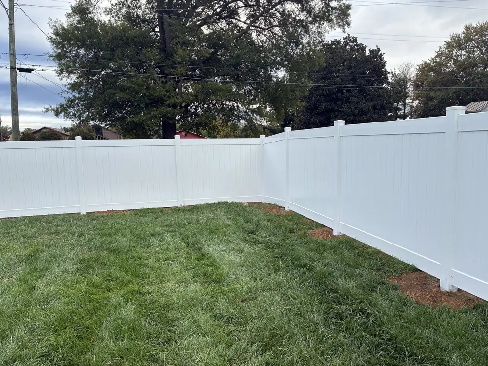 White vinyl privacy fence installed by Star City Fence Co